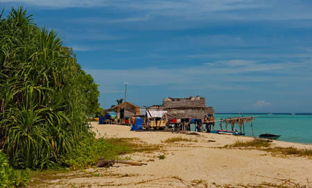 East Malaysia. Sea Gypsy village on a sandy coral reef island. The main trade of local residents is...