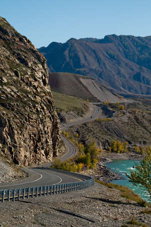Russia. mountain Altai. Thanks to the rocky banks of the Katun river surrounded by high mountains, the Chui tract is almost entirely in dangerous, but very picturesque turns.の写真素材
