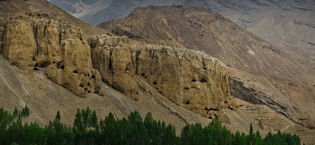 Tajikistan. South of the Pamir highway. Man-made caves in crumbling rocks of unknown origin.