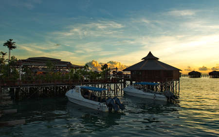 Semporna. Malaysia. December 03, 2018. In the early warm morning, moored on the sandy beach, pleasure boats await the many tourists who come to the island of Mobul for diving.のeditorial素材