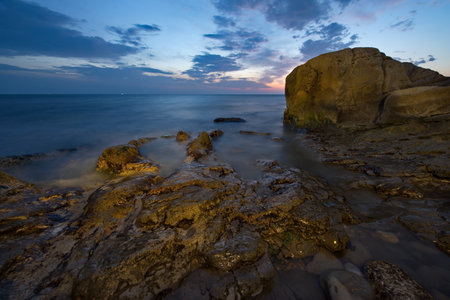 Russia. Dagestan. Dawn on the rocky shore of the Caspian Sea near the city embankment of Makhachkala.の写真素材