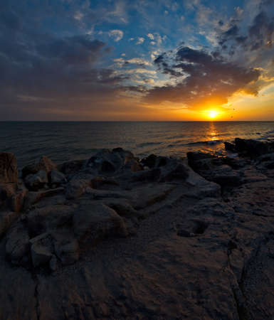 Russia. Dagestan. Dawn on the rocky shore of the Caspian Sea near the city embankment of Makhachkala.の写真素材