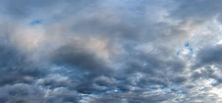 Russia. The South of Western Siberia. Gloomy sunset clouds in the evening summer sky over the fields...