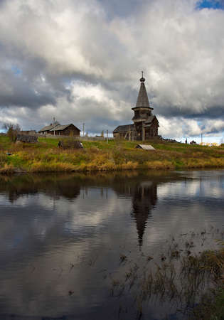 Saminsky Pogost. Russia. October 05, 2018. The ancient wooden Orthodox Church of Elijah the Prophet on the bank of the Samina River in a picturesque place of the Vologda region.のeditorial素材