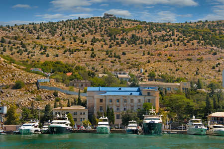 Balaclava. Russia. August 12, 2021. Tourists swim in light excursion boats along the bay of the Black Sea coast of the Crimean peninsula.のeditorial素材