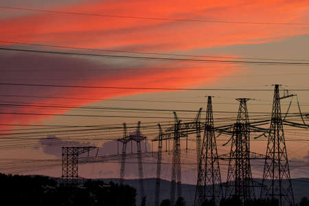 Russia. Krasnoyarsk Territory. The interweaving of electrical poles and wires against the background...