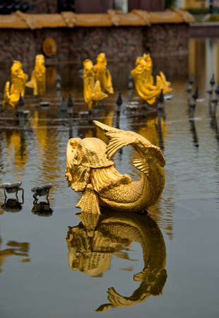 Moscow. Russia. October 01, 2021. A fragment of the central fountain Friendship of Peoples at the Exhibition of achievements of the national economy in the form of a gilded fabulous fish.のeditorial素材