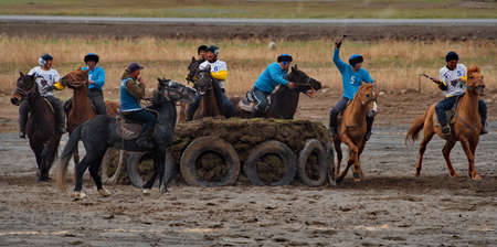 Kupchegen. Russia. May 14, 2021. Altai National Equestrian Game Kok-Boru. The moment of the players' struggle at the gate for a sports equipment in the form of a goat carcass (ulah) weighing 35 kg.のeditorial素材