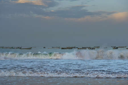 West Africa. Mauritania. Twilight waves of the Atlantic Ocean on the shore of a fishing village.