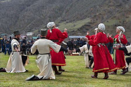 Tliarata. Russia, April 07, 2021. Men and women in national costumes perform Dagestan dance at the annual spring festival "The First Furrow" (the beginning of the sowing season in the Caucasus).のeditorial素材