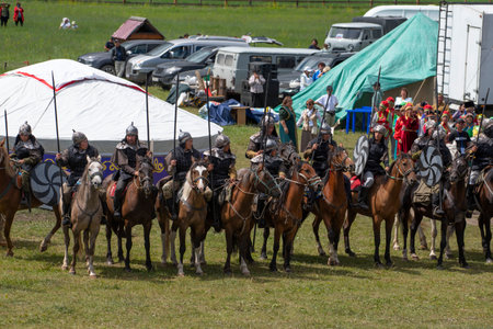 Ust-Kan. Russia. July 09, 2022. Ancient warriors on horseback are participants in a costumed...
