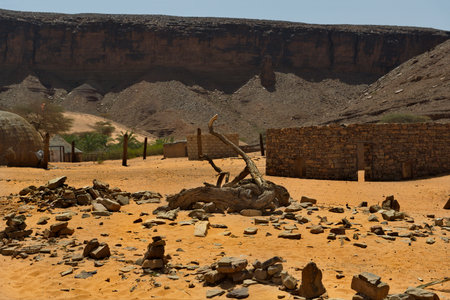 West Africa. Mauritania. Huts made of sand and stone in a village in the south of the Sahara Desert near the Terzhit oasis.の写真素材