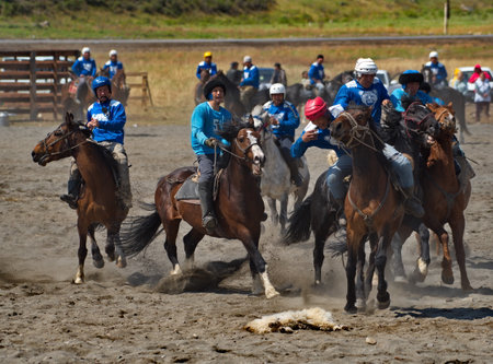 Kupchegen. Russia. May 14, 2021. Altai National Equestrian Game Kok-Boru. The moment of the fight of the players on horses for a sports equipment in the form of a goat carcass (ulaのeditorial素材