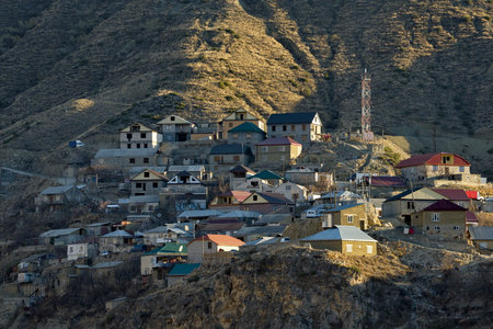 Inhelo. Russia. April 04, 2021. View of a high-mountain village located on the steep slopes of the Caucasus mountains on the left bank of the Andiyskoye Koysu River.のeditorial素材