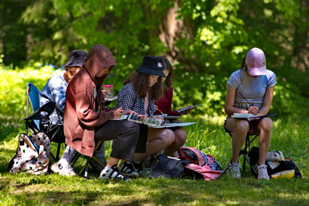 Abramtsevo. Russia. June 09, 2022. Young artists paint from nature the ancient architecture of Savva Morozov's estate in the famous open-air museum.のeditorial素材
