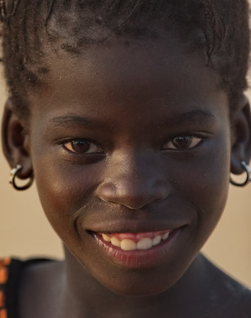 Saint-Louis. Senegal. October 11, 2023. An expressive portrait of an African girl from a small...