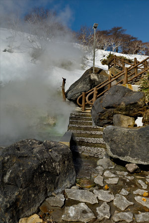 Staircase to the hot spring in the geyser valleyの写真素材
