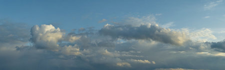 Russia. The South of Western Siberia. Gloomy sunset clouds in the evening summer sky over the fields...