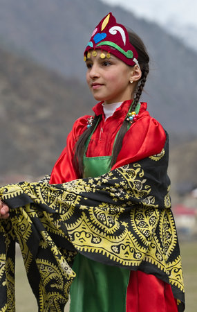 Tliarata. Russia. April 07, 2021. Portrait of a young village girl in national clothes at the annual Caucasian holiday of Dagestan The First Furrow.のeditorial素材