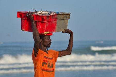 Saint Louis. Senegal. October 11, 2021. A young African fisherman goes to the fish market along the...