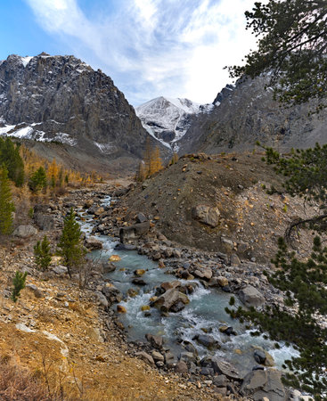 Russia. the Altai Mountains. Autumn view of the valley of the Aktru River, the source of which is located at the foot of the glacier on the North Chui mountain range.の写真素材