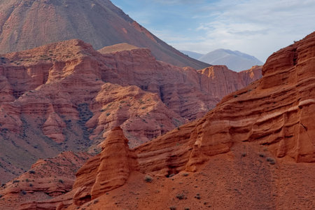 Northern Kyrgyzstan. Picturesque winding trails of the Kok Moinok canyons with red-brown rock along...