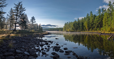 Russia, Western Buryatia. Early morning on the deserted taiga lake Guzen-Nur on the left bank of the...