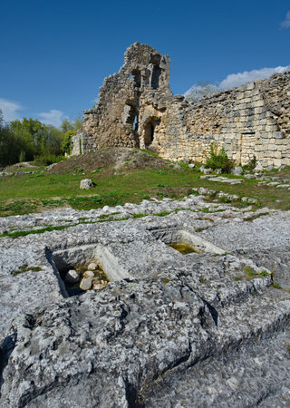 Russia, Crimea. View of the fragments of the dilapidated stone fortress of the famous Pyatigorsk city of Mangup-Kale of the 5th century in the Bakhchisarai district.の写真素材