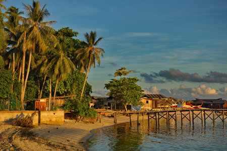 Malaysia. The east coast of the island of Borneo. Sunset on the sandy shore of the reef island of...