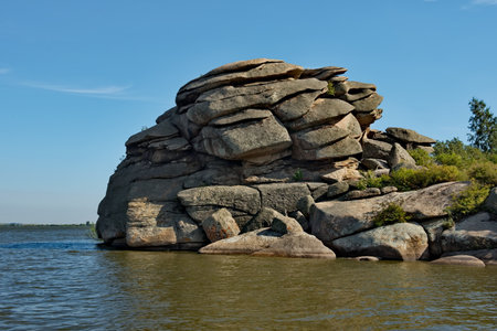 Russia. Altai Territory. Picturesque shores of Lake Kolyvan is surrounded by bizarre rocky outcrops located near the border with Kazakhstan.の写真素材