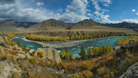 Russia. Siberia, Altai Mountains. Only in the middle of autumn, when the mountain glaciers stop melting, the water in the Katun River becomes transparent and rich turquoise color.の写真素材