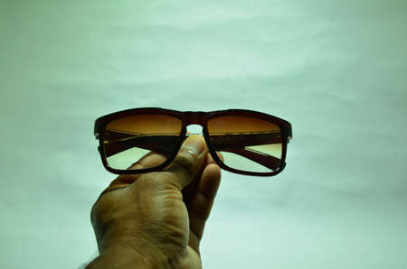 mans gogal in hand imageの写真素材