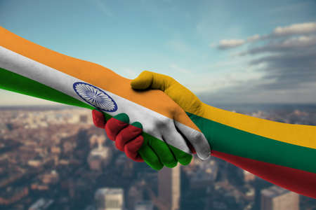 Flag of Lithuania and India countries, handshake on a background of the cityの写真素材