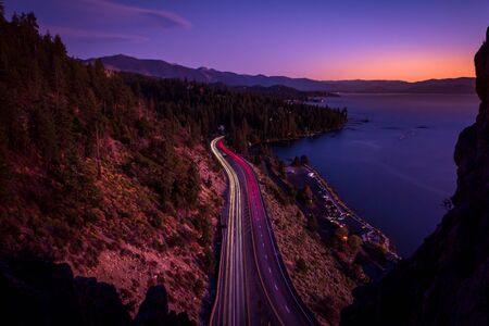 Long exposure of a Scenic Sunset at Lake Tahoe with a strips of car lights