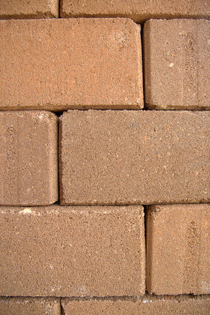 The rugged brick wall.