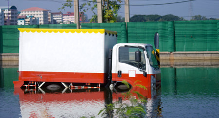 The delivery truck was unable to move because the entire route was flooded.の写真素材