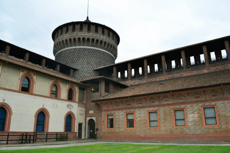 Milan, Italy, October 2021: Inner courtyard side of the walls and round corner tower in the Sforza's Castle (Castello Sforzesco).のeditorial素材