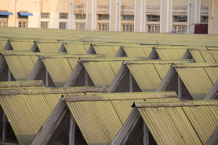 Metal roofs sheltering a train station in Myanmarの写真素材