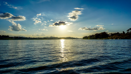 Sunset at Mekong river seeing from Chiang Khan District Thailand and Laos at the opposite sideの写真素材