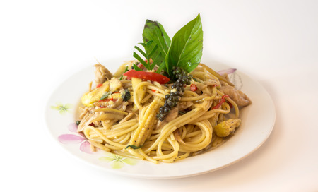 spicy stir fried Spaghetti or thai Pad Kee Mao with chicken isolated on white backgroundの写真素材