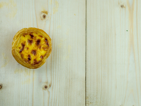 Egg tart on wood tableの写真素材