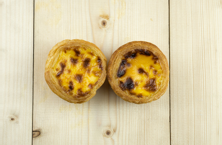 Egg tarts on wood tableの写真素材