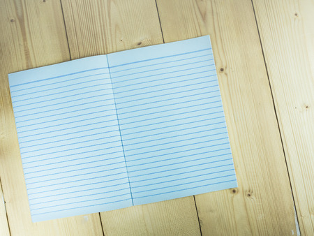 Note book, empty pages on wood tableの写真素材