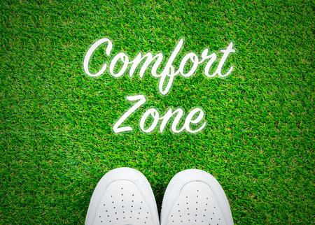 Comfort zone text on grass with shoes; travel concepts backgroundの写真素材