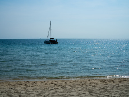 Sea and beach view, with boat and coastの写真素材