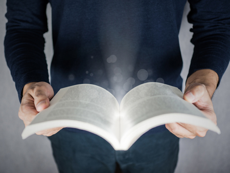Magic effect on book opening top view, education and reading conceptの写真素材