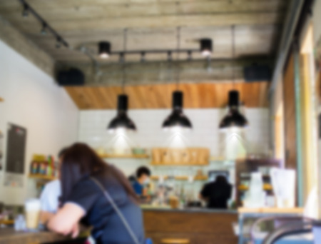 Blurred vintage cafe with customers