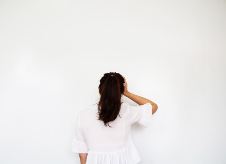 Girl touching head by hand, headache and stress gestureの写真素材