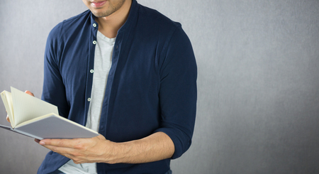Man opening book with copy spaceの写真素材