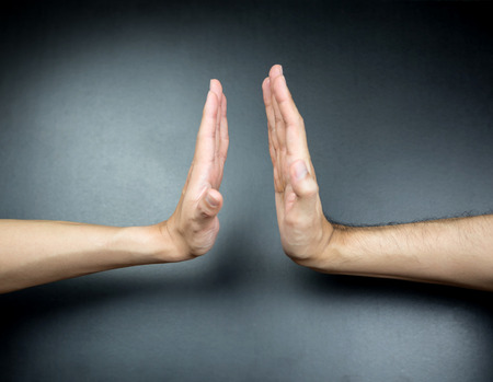 High five, hand gesture on black backgroundの写真素材